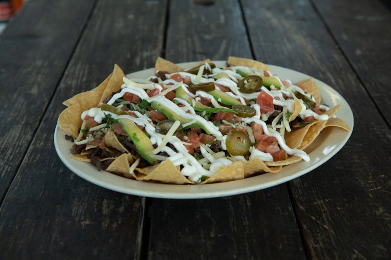 Tostada salad in crispy shell bowl with fresh ingredients